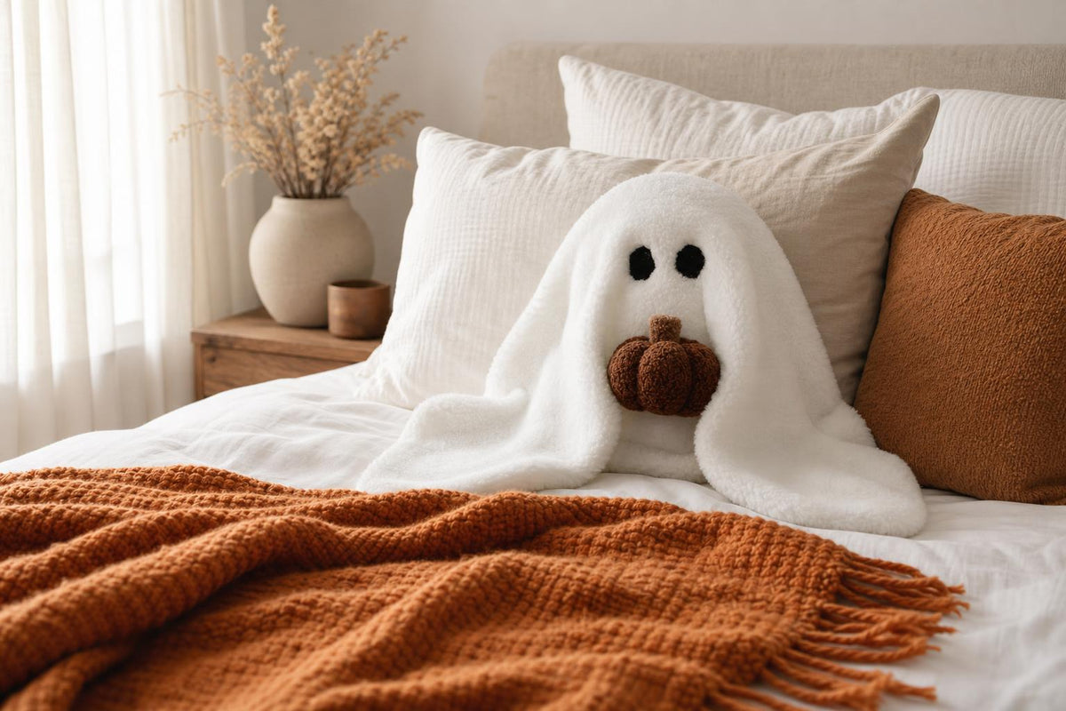 Ghost and pumpkin plush pillow - bedroom lifestyle